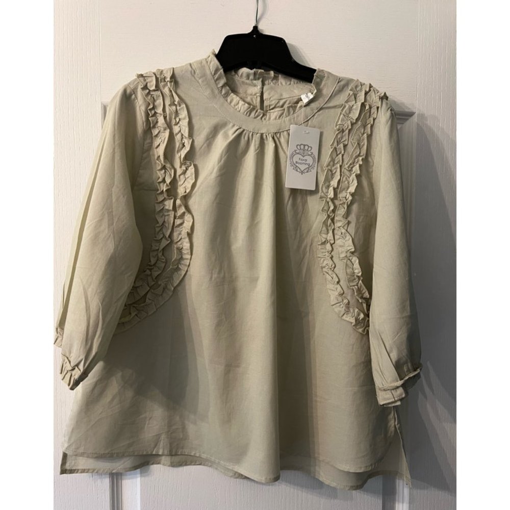 Light sage green ladies top.